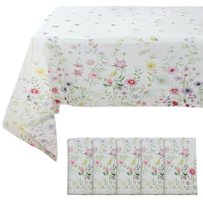 Floral tablecloth and napkins set on a white background