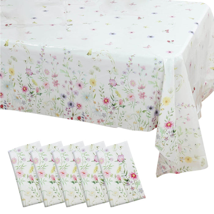 Floral tablecloth and napkins set on a white background