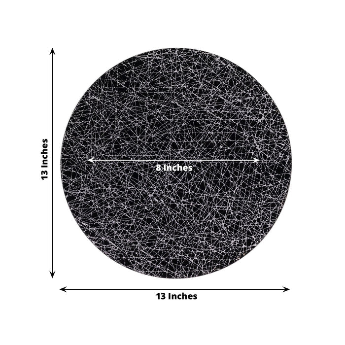 Black round plate with intricate line design, 13 inches in diameter.