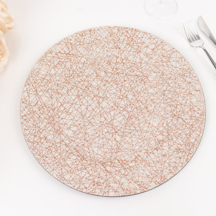 Decorative round plate with a textured design in gold and white tones
