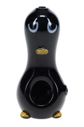 Penguin-shaped glass hand pipe with black body, white belly, yellow beak, and yellow feet