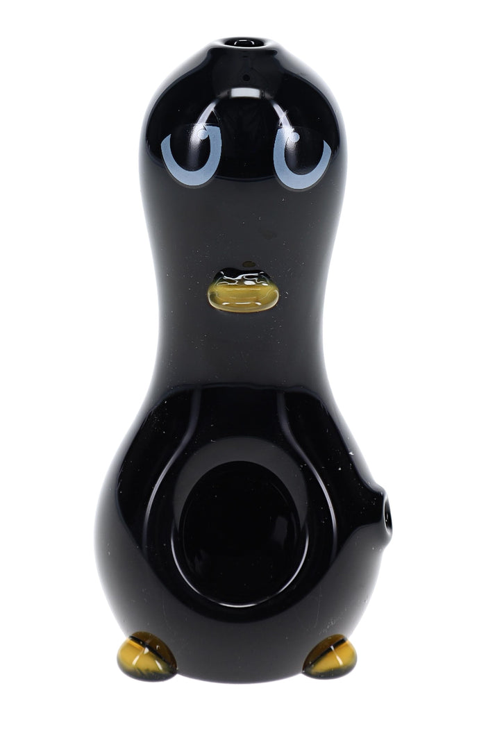 Penguin-shaped glass hand pipe with black body, white belly, yellow beak, and yellow feet