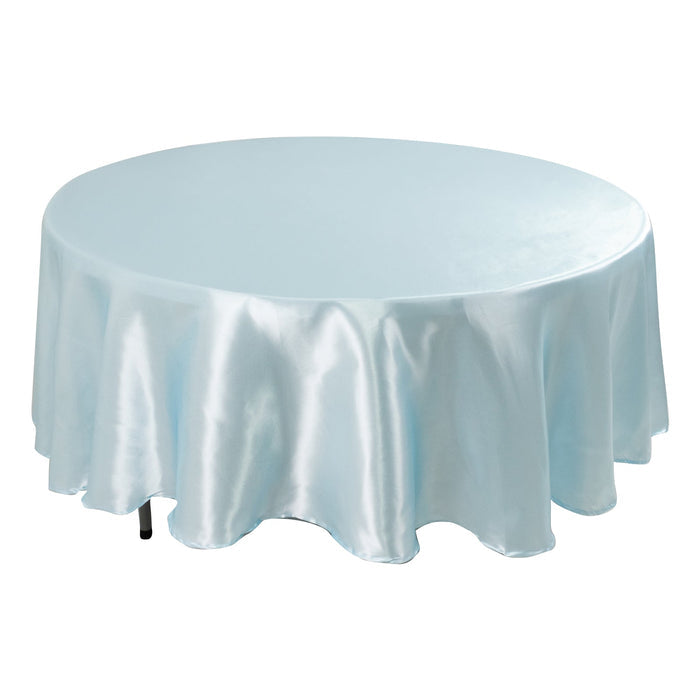 Round light blue satin tablecloth on a plain surface.