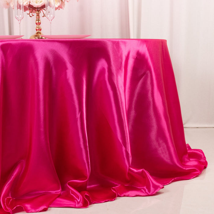 Pink satin tablecloth draping elegantly over a table.