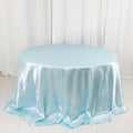 Round light blue satin tablecloth on a plain backdrop