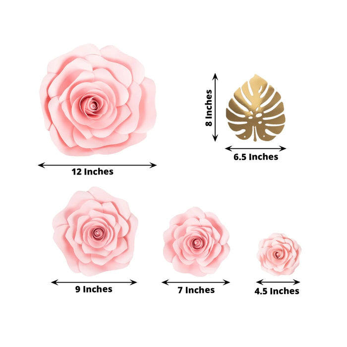 Pink paper flower set with various sizes and a gold leaf accent on white background